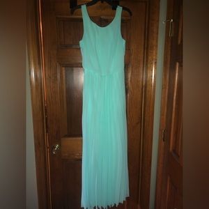 Floor Length Formal Dress. Mint Green with pleaded skirt. Wide shoulder strap.